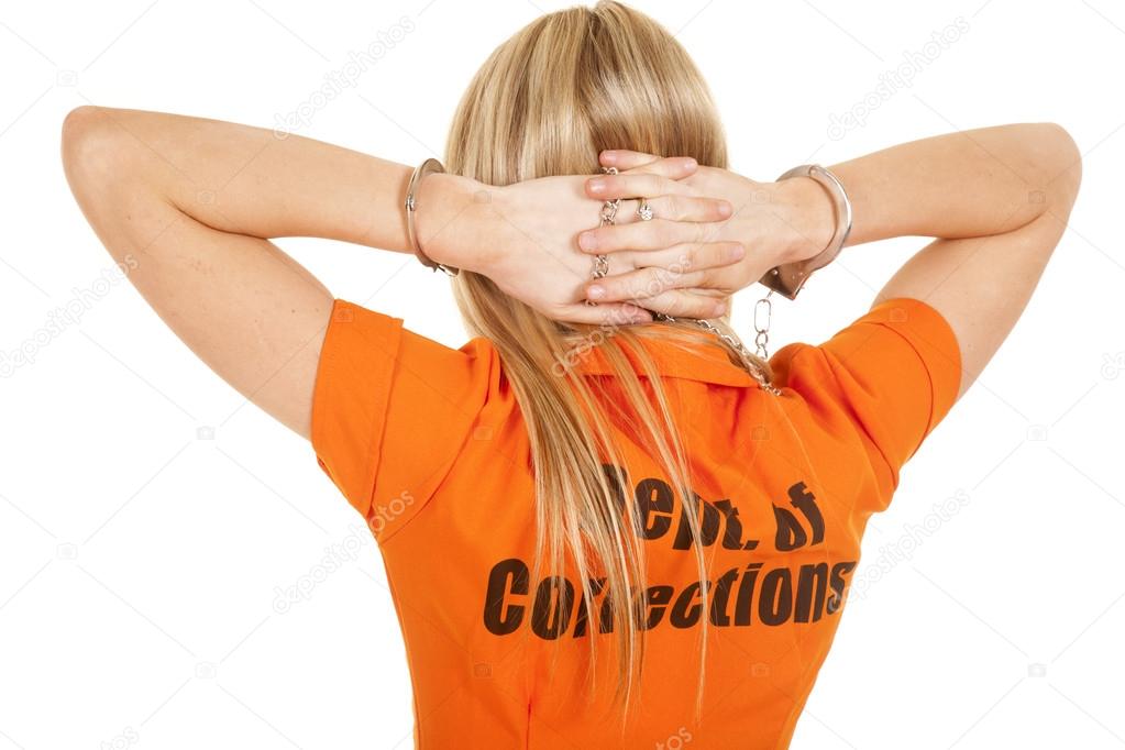 prisoner orange back hands behind head