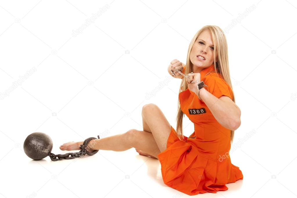 prisoner orange ball cuffs sit mad
