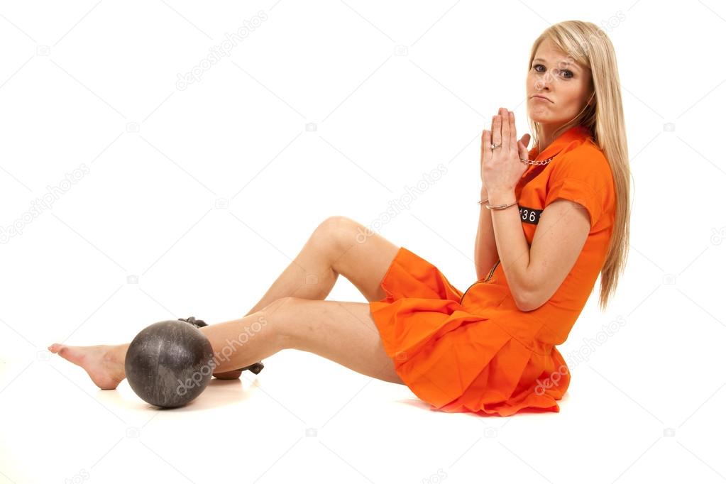 prisoner orange ball cuffs sit pray