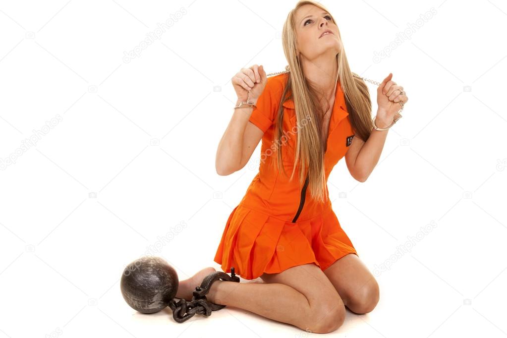 prisoner orange kneel ball look up