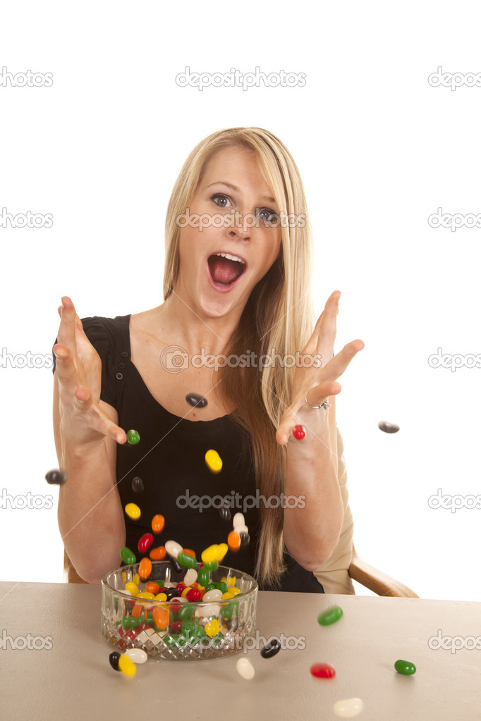 woman eating jelly beans and throwing them