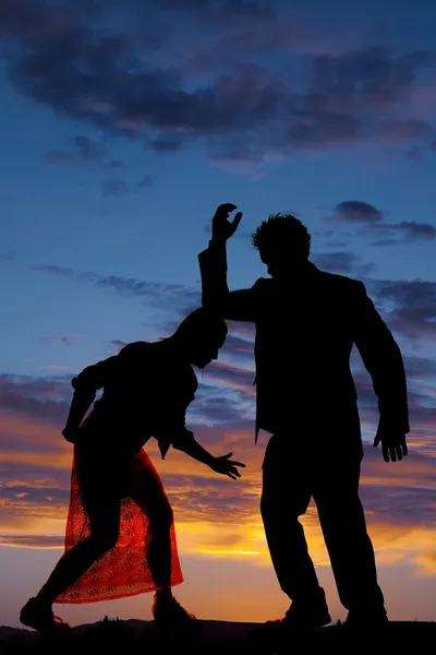 Silhouette man woman facing each other elbow on head — Stock Photo, Image