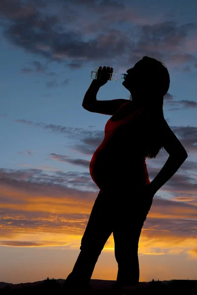 Woman silhouette drinking — Stock Photo, Image
