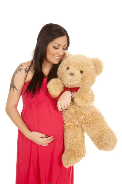 Mulher grávida segurando um urso de pelúcia — Fotografia de Stock