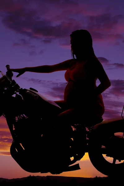 Silhouette pregnant woman on motorcycle. — Stock Photo, Image