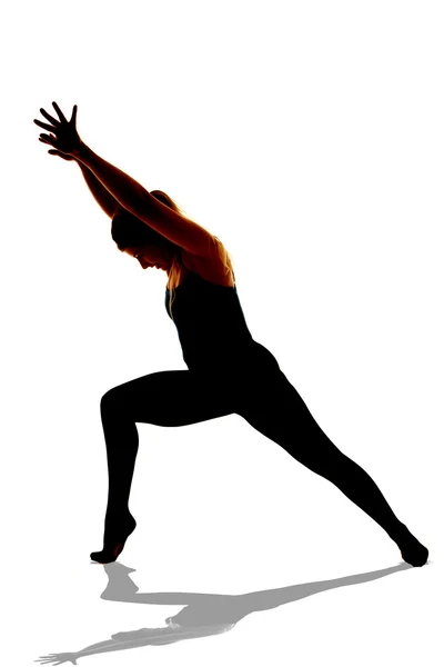 Silhouette of woman dancing lunge lean — Stock Photo, Image