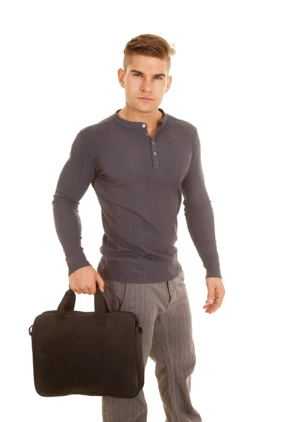 Man gray long sleeve shirt stand hold bag serious — Stock Photo, Image