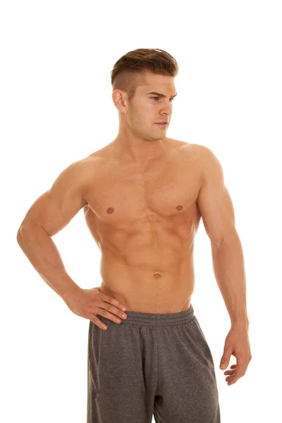 Man no shirt stand hand hip shorts look side — Stock Photo, Image