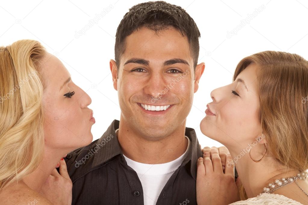 two women ready to kiss man close big smile