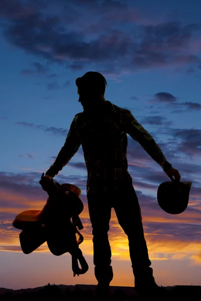 Homem silhueta cowboy sela segurar chapéu — Fotografia de Stock