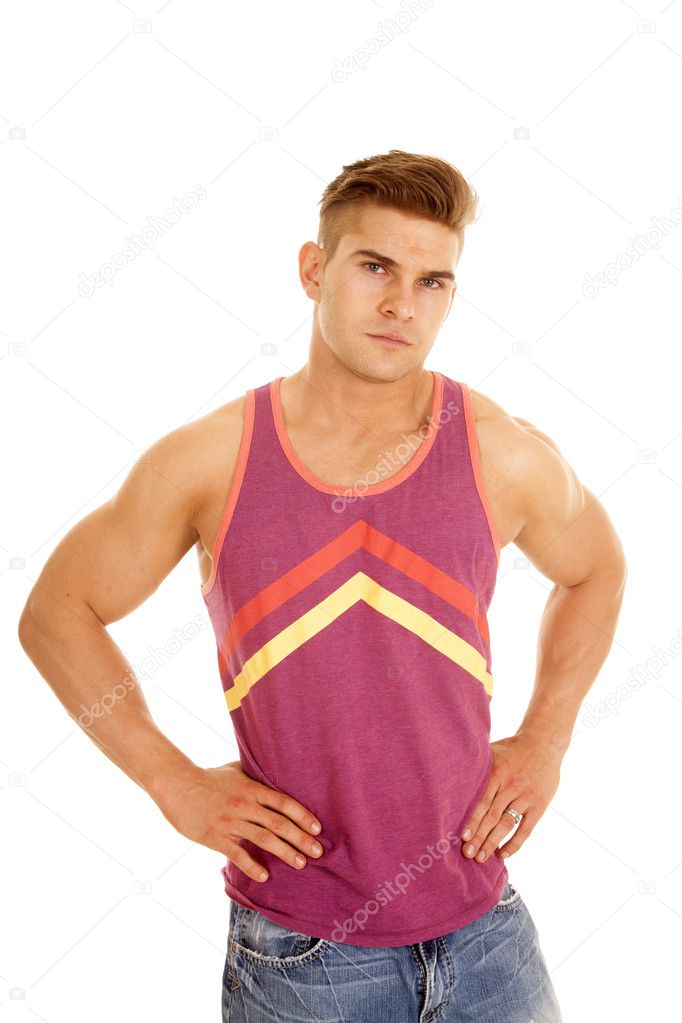 man puple tank top hands hips looks serious