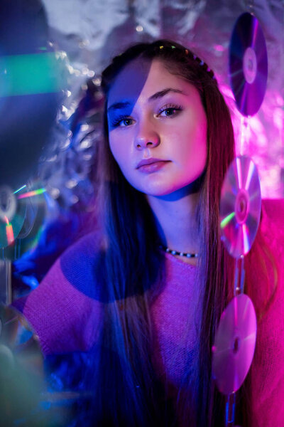 Cinematic night portrait of girl and neon lights. Fashion. Woman in Colorful neon light. girl in disco, makeup dance. Party disco neon nightclub vibes. creative art neon pink blue light.