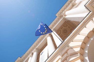 flag of the European Union on a building against a blue sky