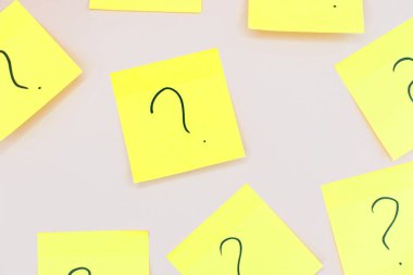 question marks on yellow stickers