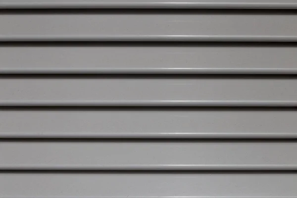 perpendicular view of an aluminum shutter with gray painted strips