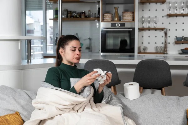Young Sick Stressed Woman Lying Home Covered Blanket Blowing Her — Stock Fotó