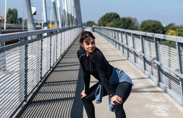 Young woman cancer survivor decides to change her way of life after illness and start practicing every morning as new life routine. Female workout training outdoor for health and happiness.