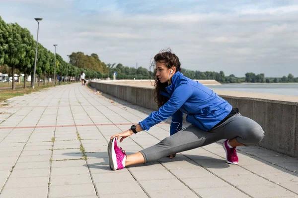 Young woman cancer survivor decides to change her way of life after illness and start practicing every morning as new life routine. Female workout training outdoor for health and happiness.