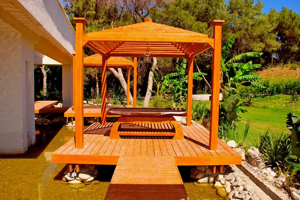 Wood pavilion in tropical garden on summer resort — Stock Photo, Image