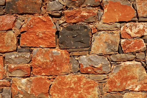 Parede de pedra mediterrânea áspera como fundo — Fotografia de Stock