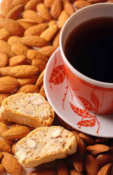 Coffee with biscotti on almond background — Stock Photo, Image