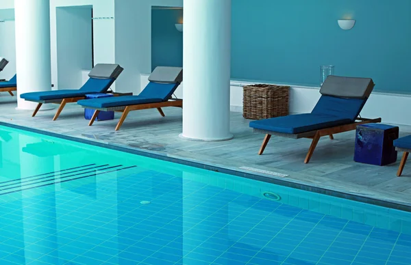 Blue resort pool interior with pool bed — Stock Photo, Image