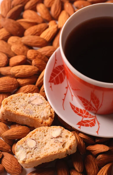 Coffee with biscotti on almond background — Stock Photo, Image