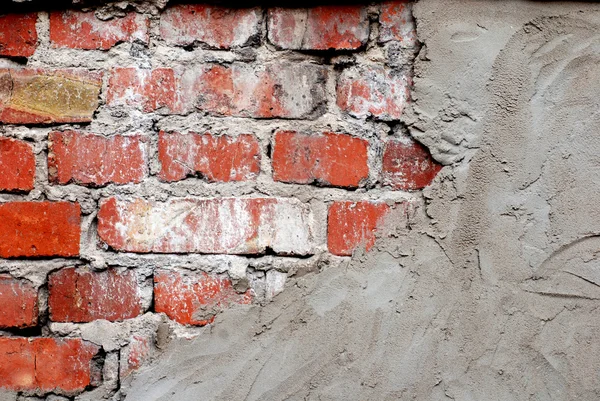Oude bakstenen muur met beton — Stockfoto