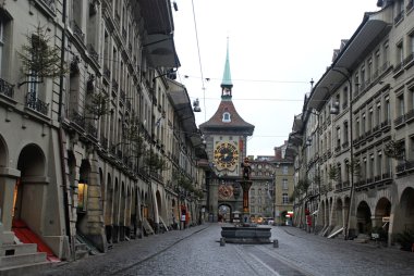 The medieval Zytglogge clock tower and Zahringer fountain in Bern clipart