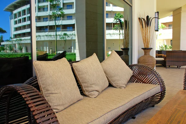 Sofa with cushion on terrace of summer resort — Stock Photo, Image