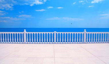 Terrace with balustrade overlooking the sea clipart