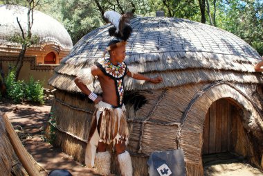 Zulu warrior man in Lesedi Cultural village, South Africa. clipart