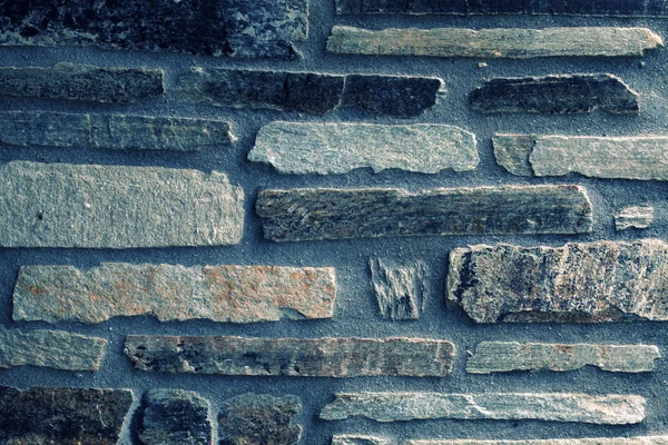 Stenen muur achtergrond en textuur — Stockfoto