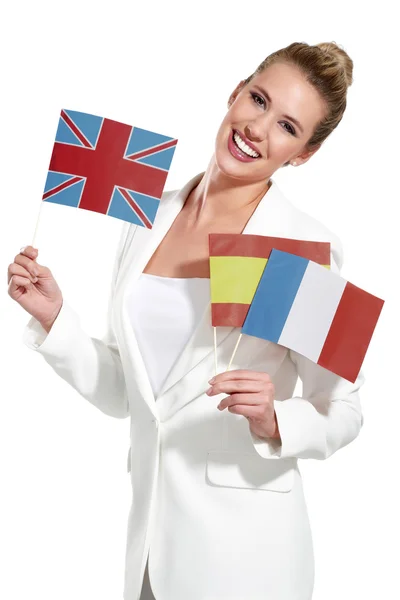 Beautiful woman showing international flags — Stock Photo, Image