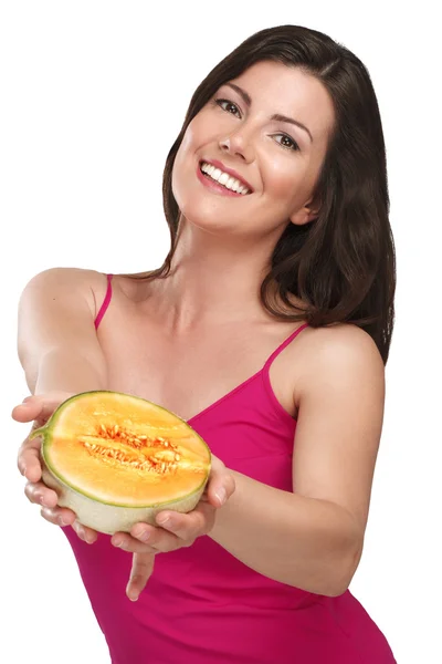 Young beautiful woman showing fresh fruits of season — Stock Photo, Image