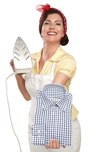 Happy beautiful woman housewife ironing a shirt — Stock Photo, Image