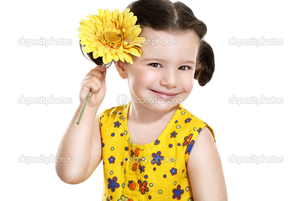 Pretty baby girl with a yellow flower in her hand — Stock Photo