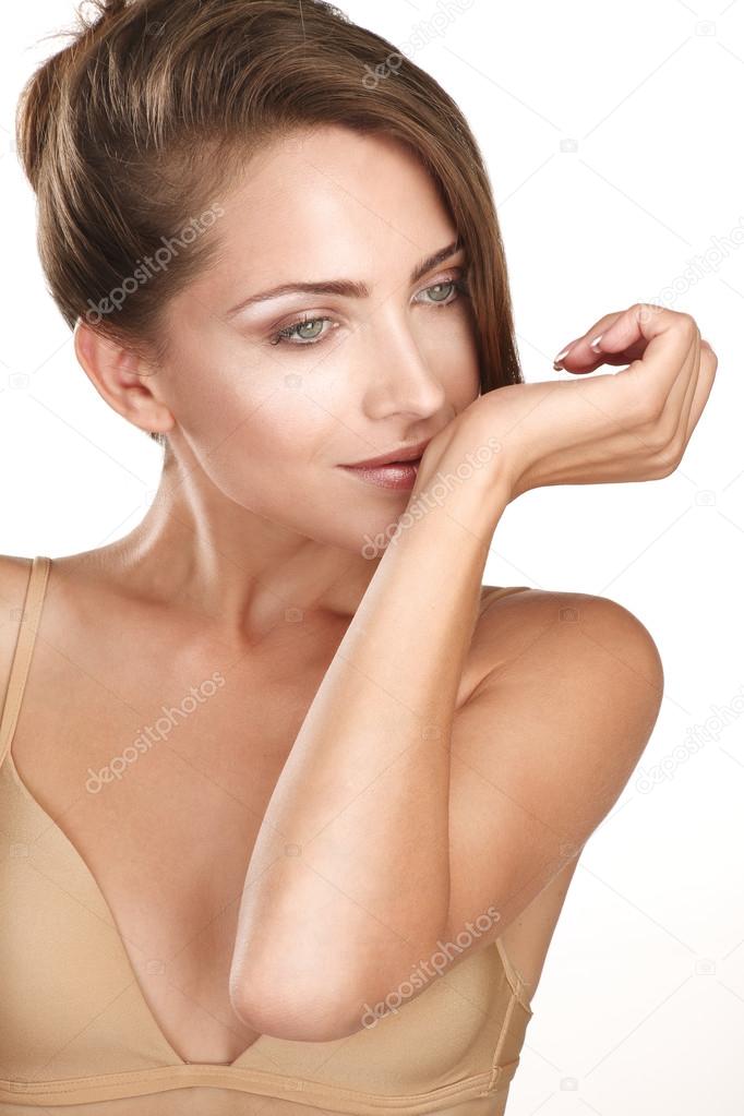 beautiful brunette female model smelling her perfume