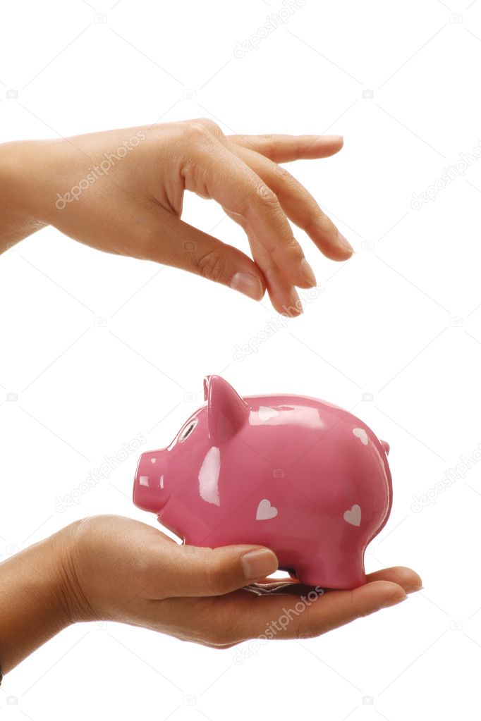 Female hands holding a piggybank empty space to insert a coin