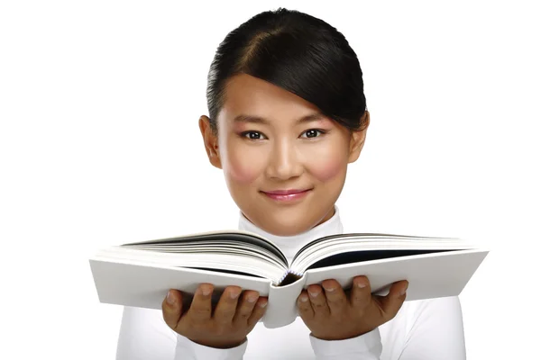 Beautiful asian chinese girl showing a blank book — Stock Photo, Image