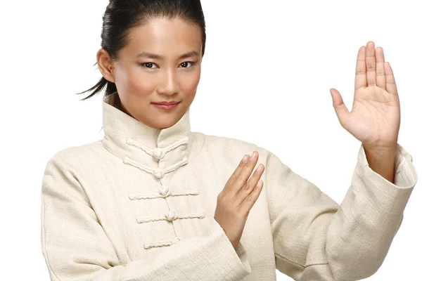 Beautiful asian woman make kung fu gesture — Stock Photo, Image