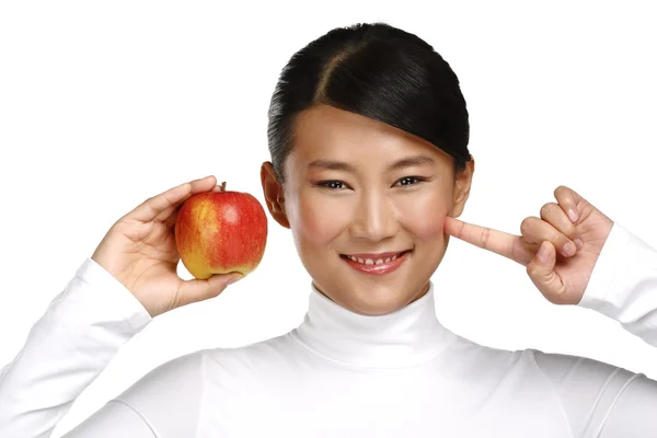 Young pretty asian woman eating an apple — Stock Photo, Image