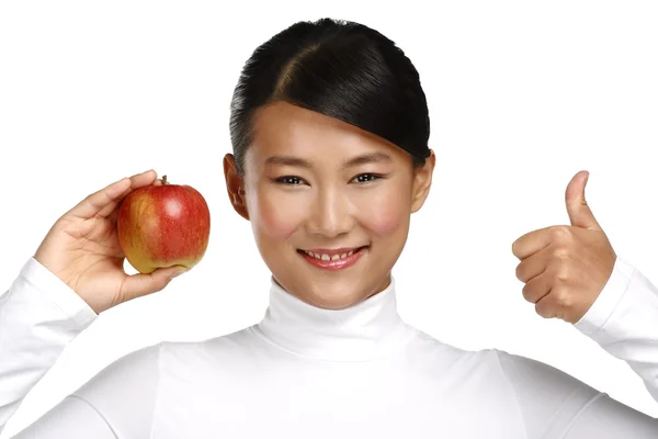 Young pretty asian woman eating an apple — Stock Photo, Image