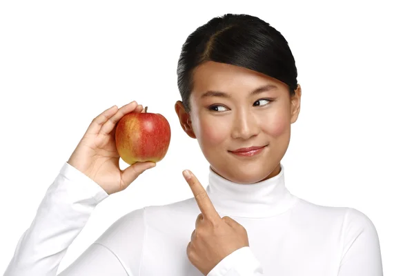 Young pretty asian woman eating an apple — Stock Photo, Image