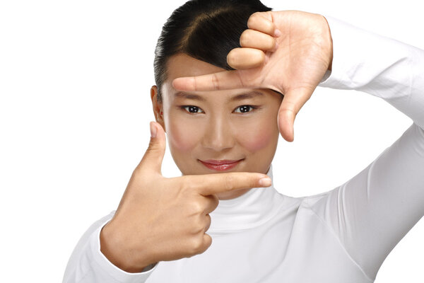 Beautiful asian woman make a frame shot symbol with her hands