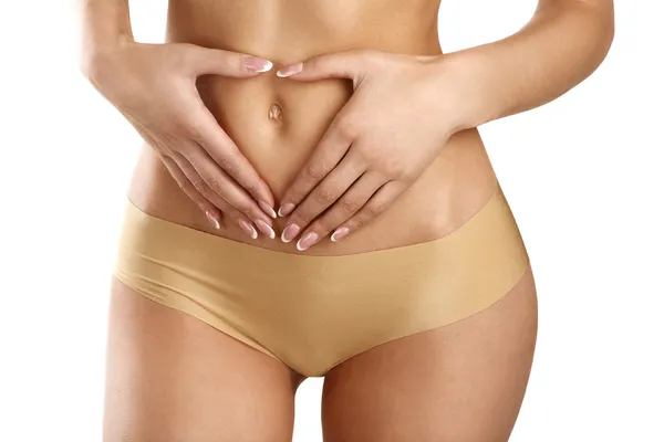 Close up of a young woman showing very flat belly — Stock Photo, Image