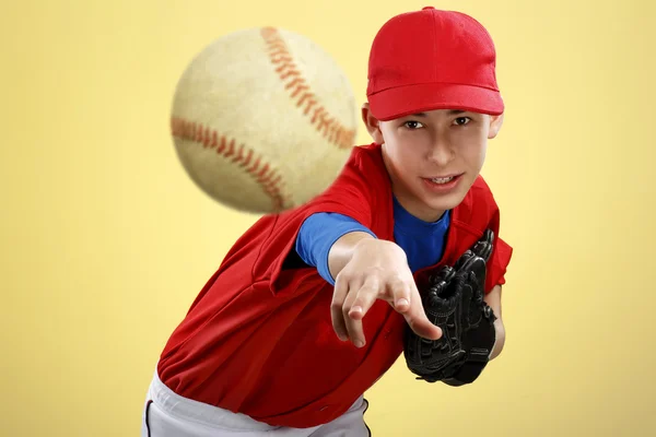 Portrait of a beautiful teen baseball player in red and white un — Stock Photo, Image