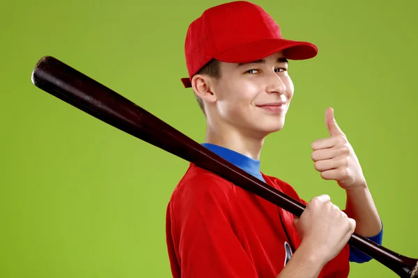 Portrait of a beautiful teen baseball player in red and white un — Stock Photo, Image