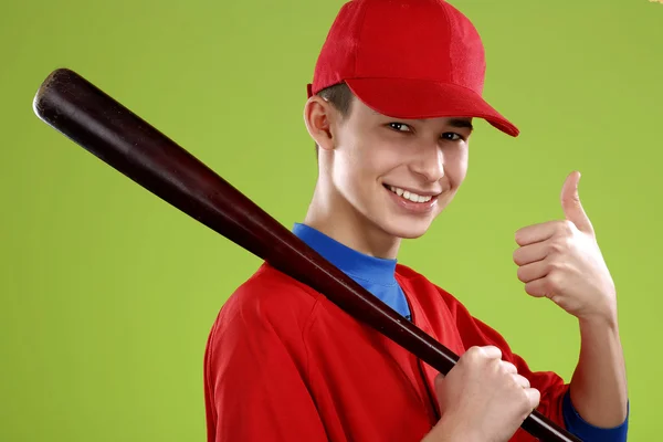 Portrait of a beautiful teen baseball player in red and white un — Stock Photo, Image