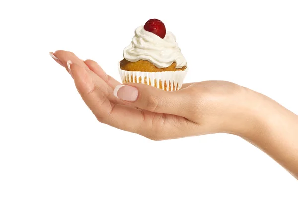 Nahaufnahme von schönen weiblichen Hand geben eine reiche Cupcake — Stockfoto